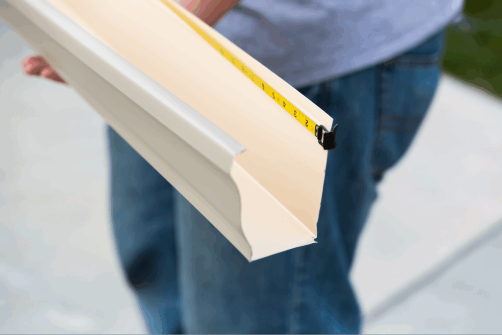 A gutter being measured.