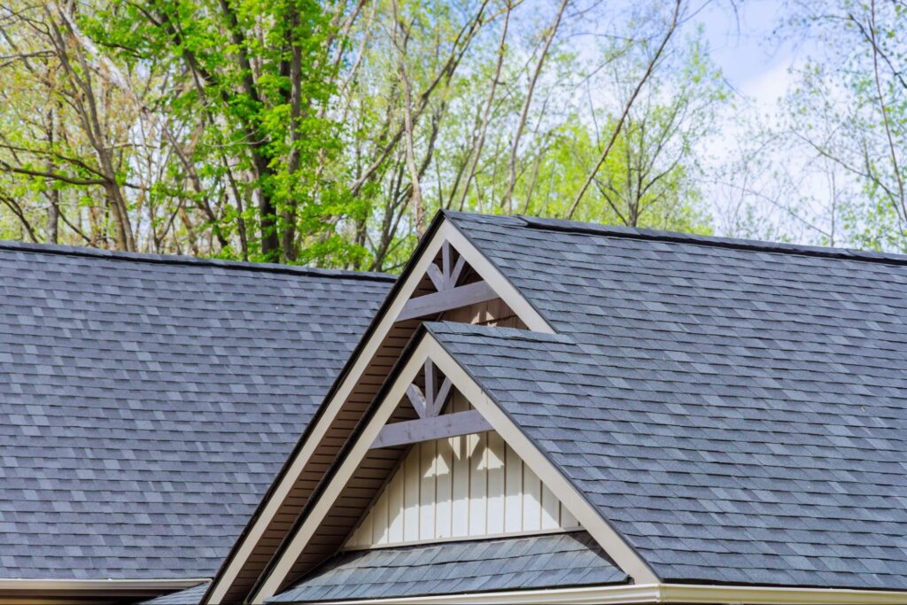 Newly constructed house with asphalt roofing shingles covering the roof.